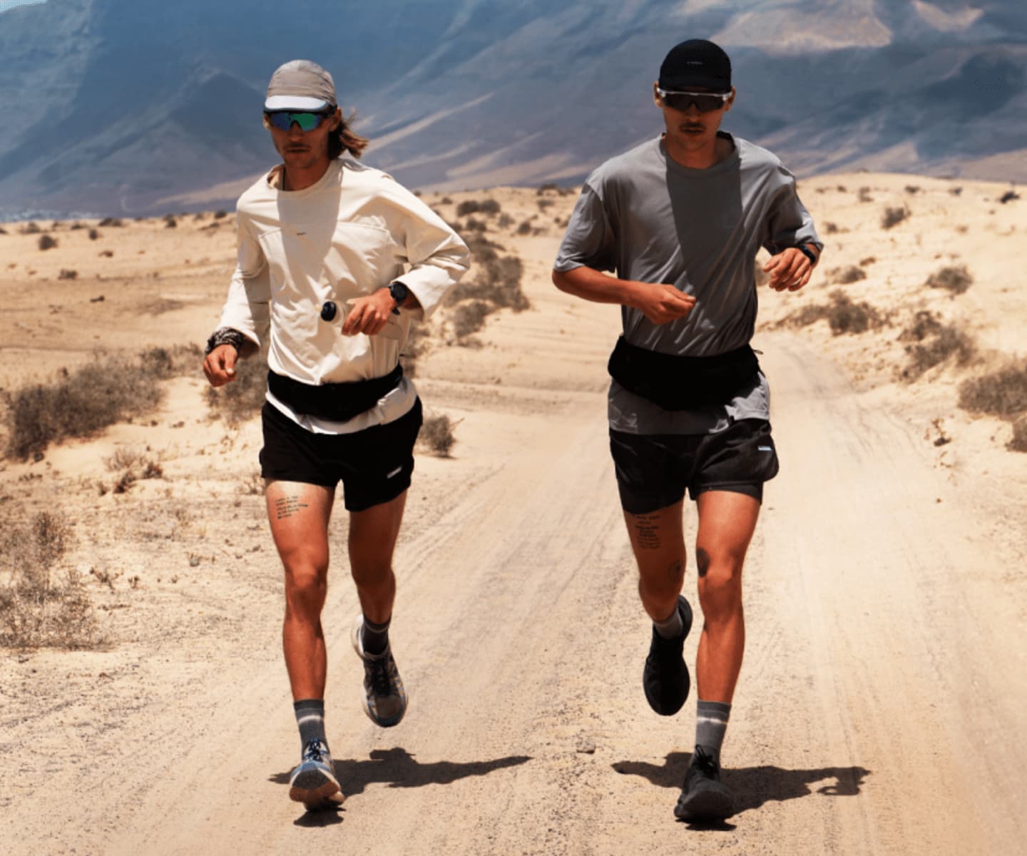 Two men running in Veja running shoes